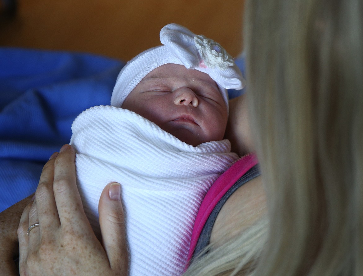 Cora was born late Tuesday night to Brent and Melanie Everson of Coeur d'Alene and joins her two big brothers, Andy, 10, and Riley, 3. This is the first baby girl on Brent's side of the family in 104 years. (LOREN BENOIT/Press)