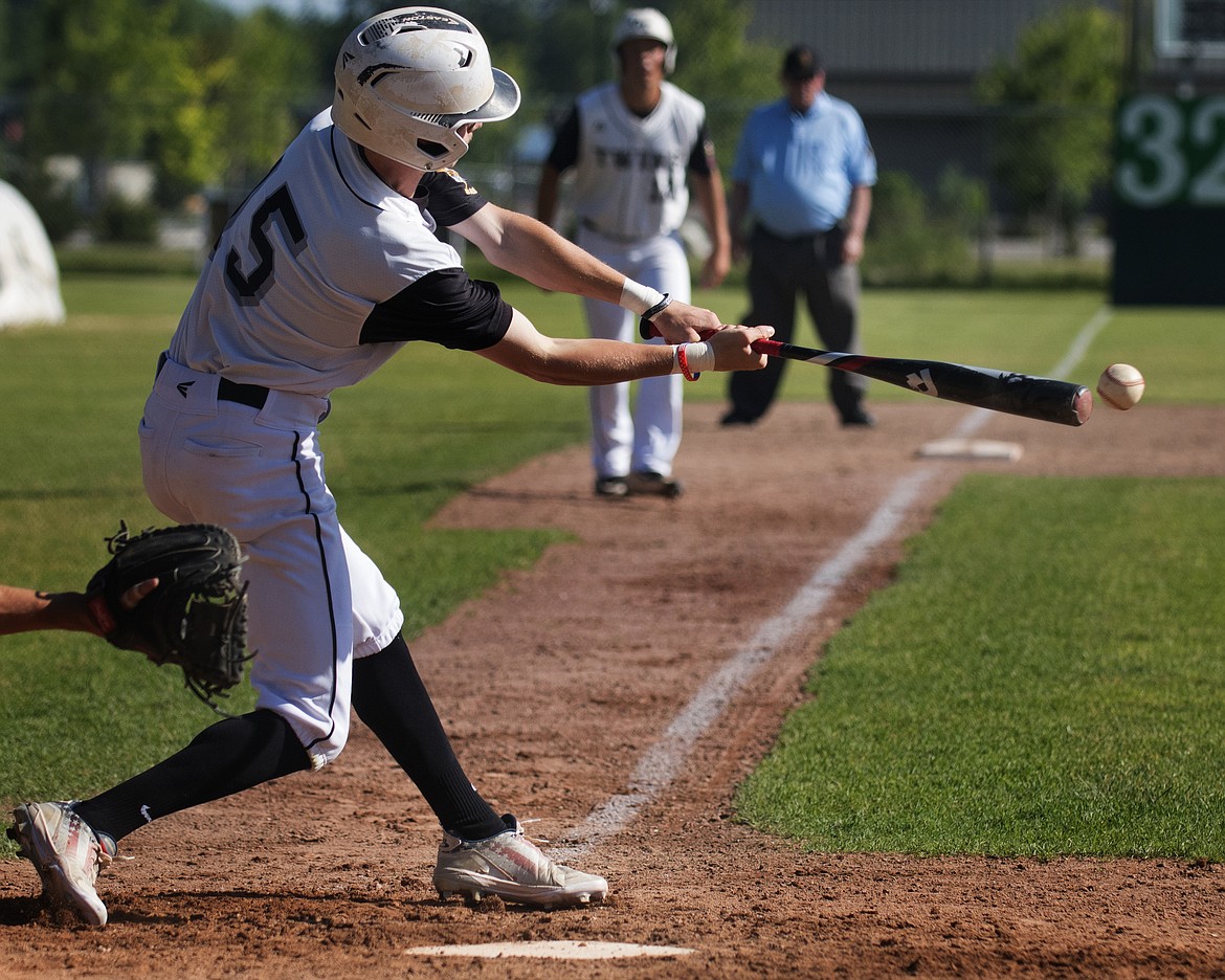 Caleb Meehan connects on a Cranbrook pitch.