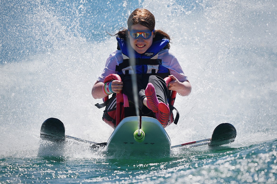 Hope Schock enjoys a ride around Echo Lake on a sit-ski as part of the Summer Water Sports Program with DREAM Adaptive Recreation on Thursday. (Casey Kreider/Daily Inter Lake)