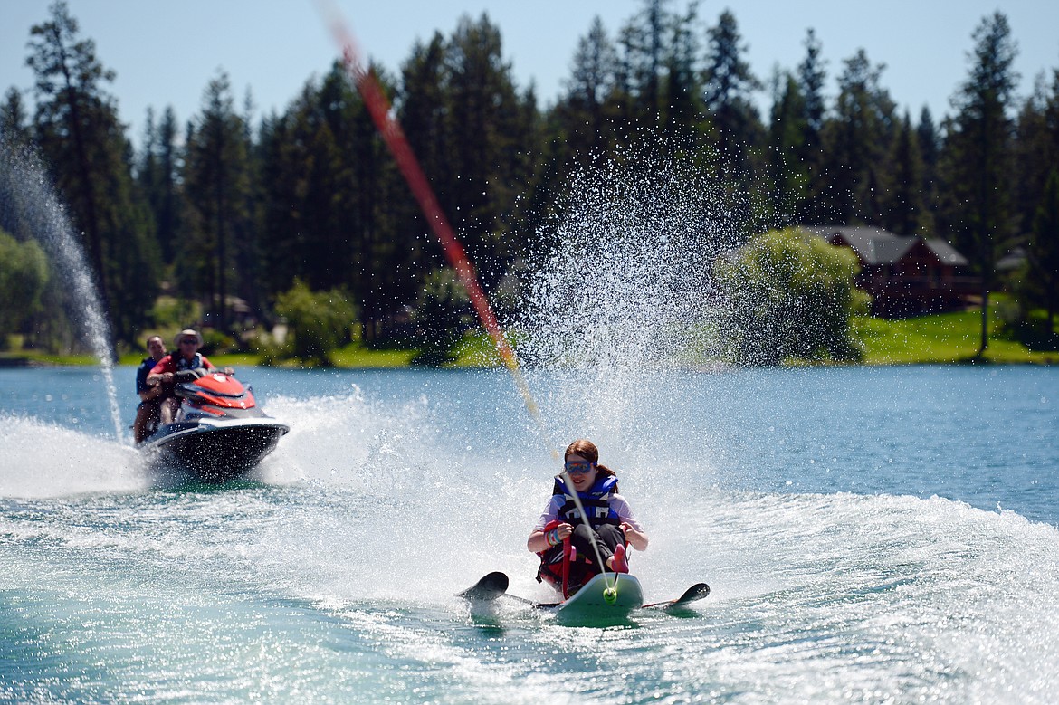 Hope Schock enjoys a ride around Echo Lake on a sit-ski as part of the Summer Water Sports Program with DREAM Adaptive Recreation on Thursday. (Casey Kreider/Daily Inter Lake)