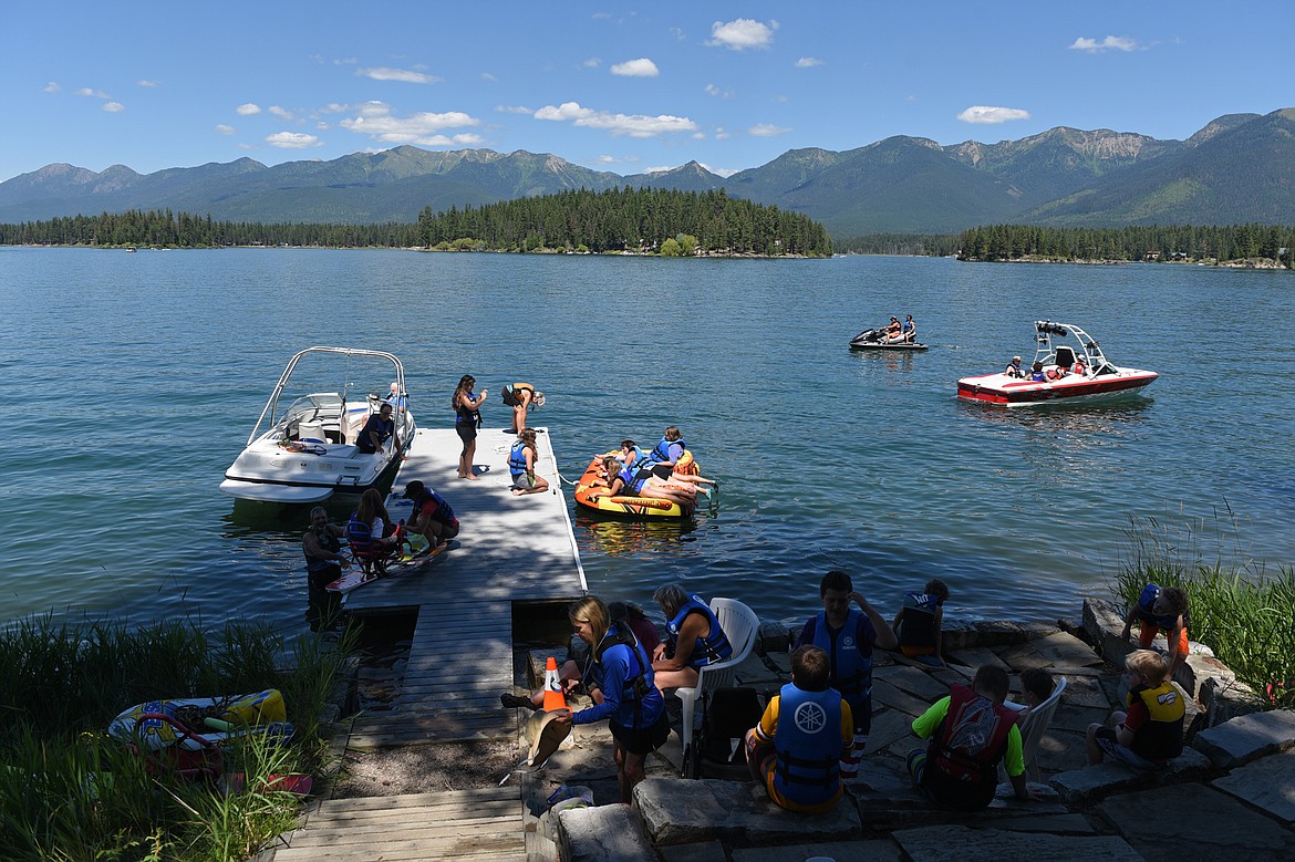 Participants take turns on the water at Echo Lake during DREAM Adaptive Recreation's Summer Water Sports Program on Thursday. (Casey Kreider/Daily Inter Lake)