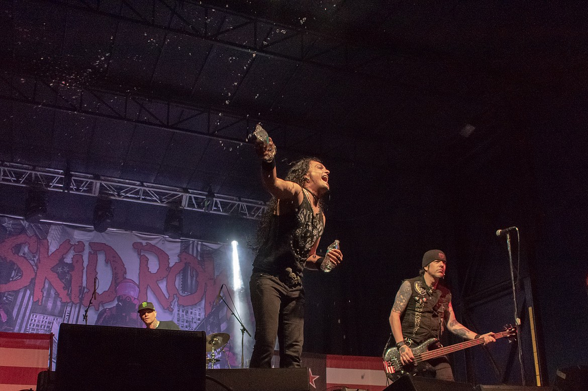 Skid Row frontman ZP Theart helps the crowd stay hydrated during the Big Sky Bash to benefit the Card Foundation on Saturday. (Ben Kibbey/The Western News)