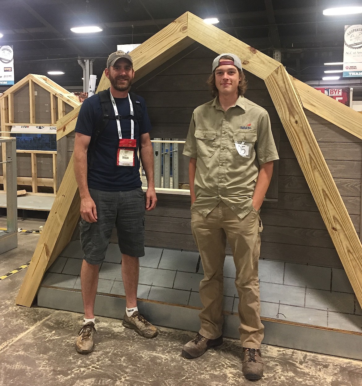Post Falls High graduate Kadin Stowers, right, poses with the model he constructed at the SkillsUSA Championships in Louisville and his instructor Casey Syth. (Photo courtesy of Jill Stowers)