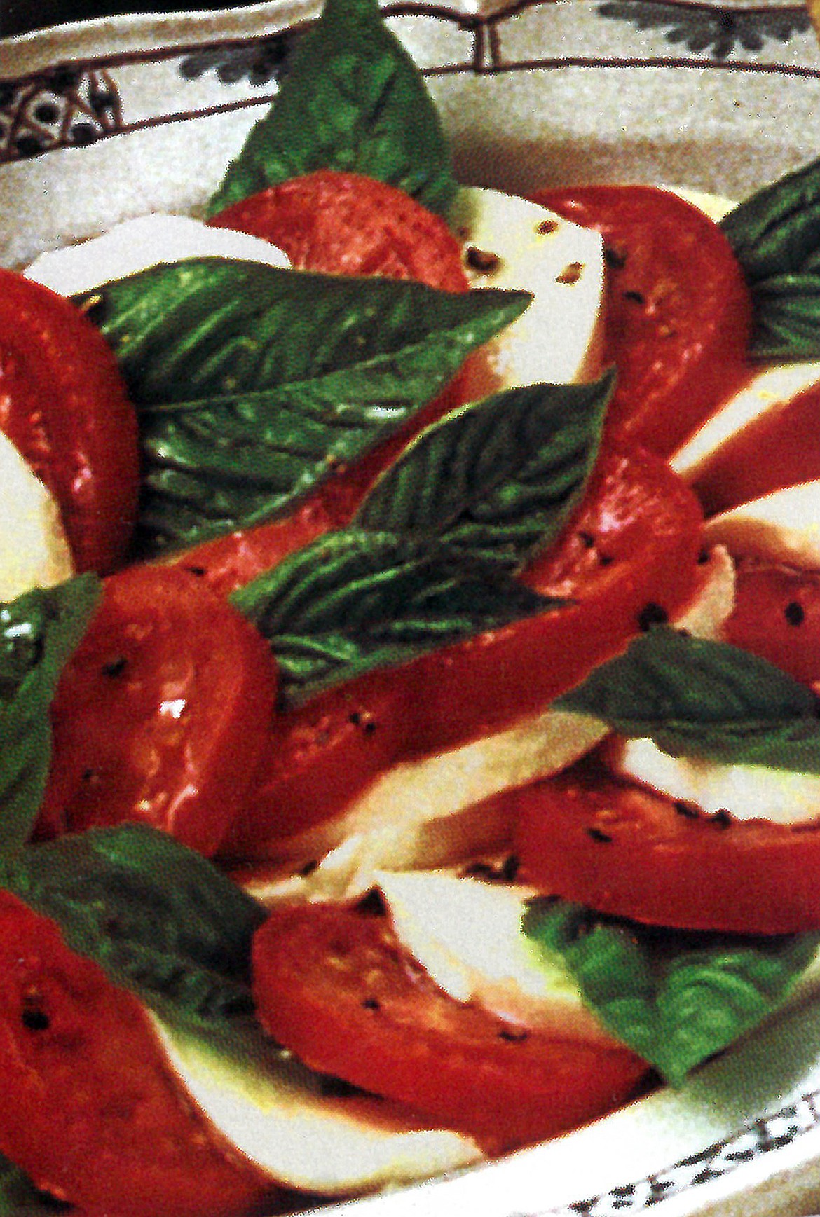 The easiest &#8211; and possibly best &#8211; salad in the world is simple tomato and Mozzarella cheese slices topped with herbed olive oil and fresh basil leaves.