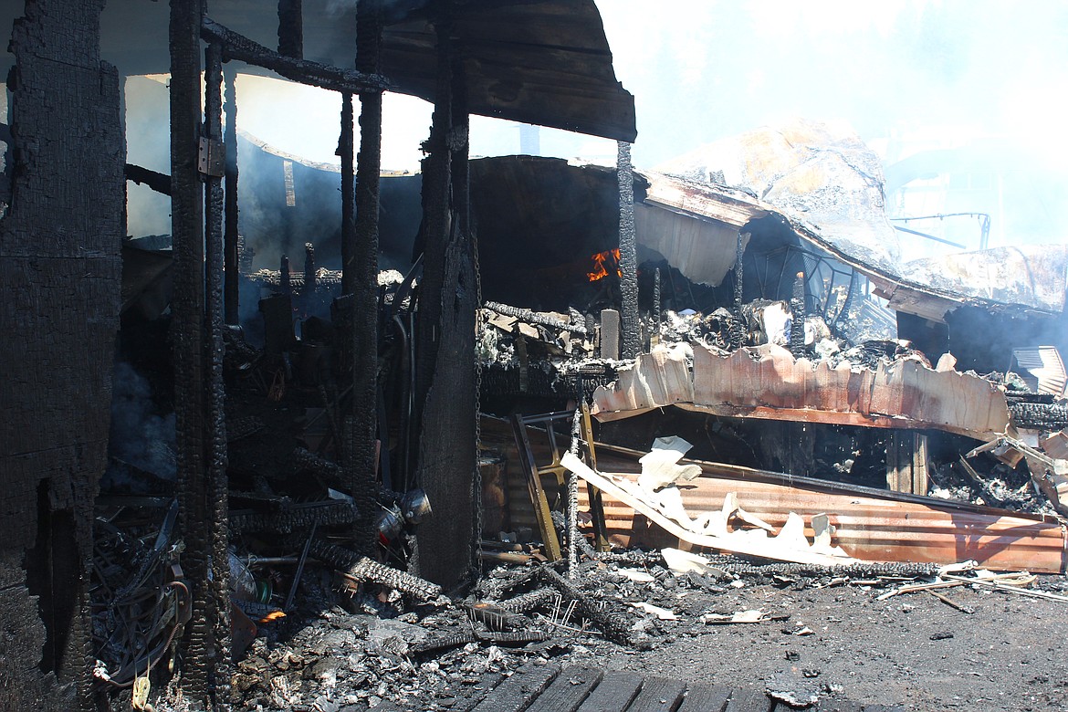 The fire smolders inside the first living trailer where the fire is believed to have originated.