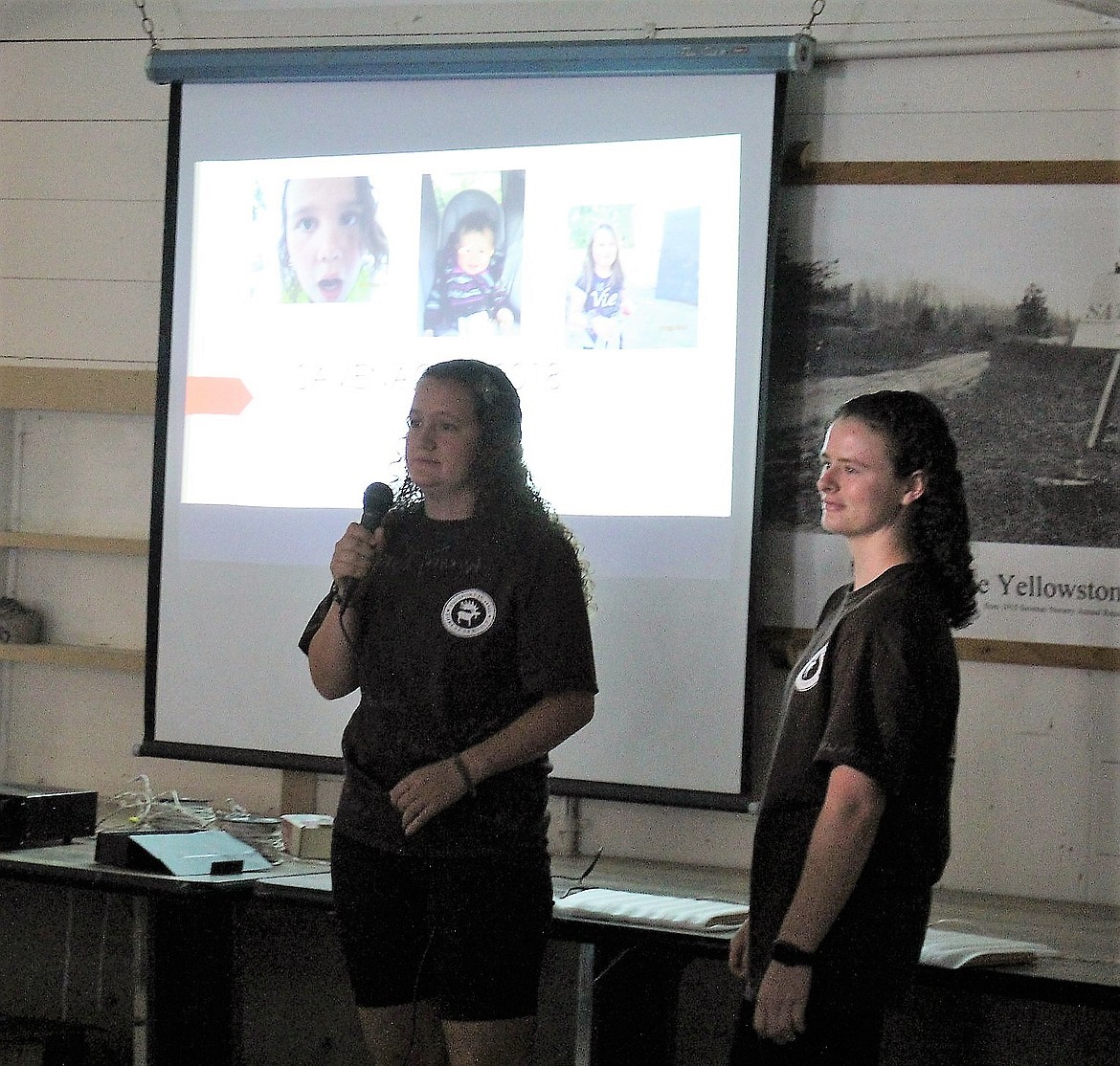 Passport in Time volunteers, Rebecka Seward and Tyra Trumble, gave a slide show presentation of what work crews accomplished during their week at Savenac on July 13. (Photo by Kathleen Woodford/Mineral Independent)