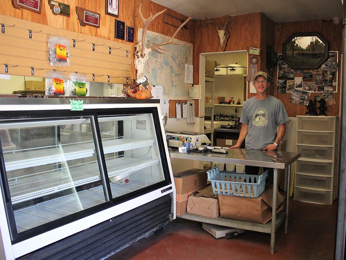 Superior Meats owner Jerry Stroot stands behind the counter in the processing plant&#146;s small retail space. With a recent CDBG grant, he plans to expand the retail area by 50 feet. (Kathleen Woodford photos/Mineral Independent)
