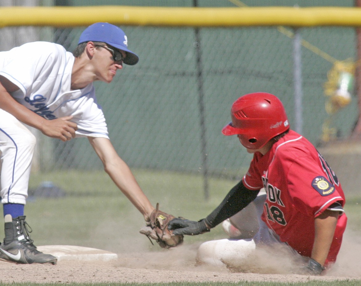 Third baseman Moxley Roesler-Begalke tags Hayden Mastel as he stretches for a triple in the top of the fifth inning in the second game of a doubleheader vs. Cranbrook Saturday. (Paul Sievers/The Western News)