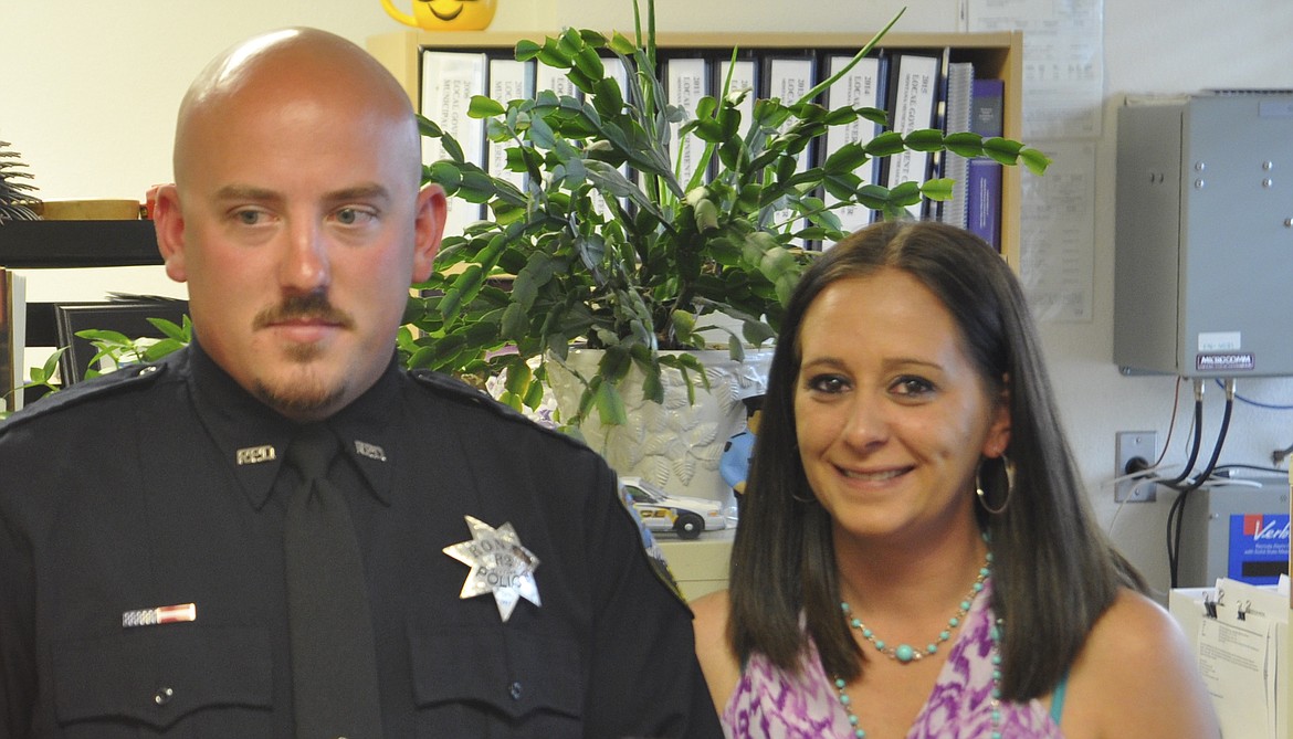 RONAN OFFICER Corey White, left, and girlfriend Brittany Hortin pose for photos after a Ronan City Council meeting last week, where White was re-hired. (Ashley Fox/Lake County Leader)