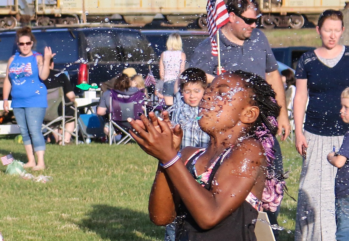 Photo by MANDI BATEMAN
Water Balloon toss results in a failed catch during the Family Night put on by the Lion&#146;s Club.