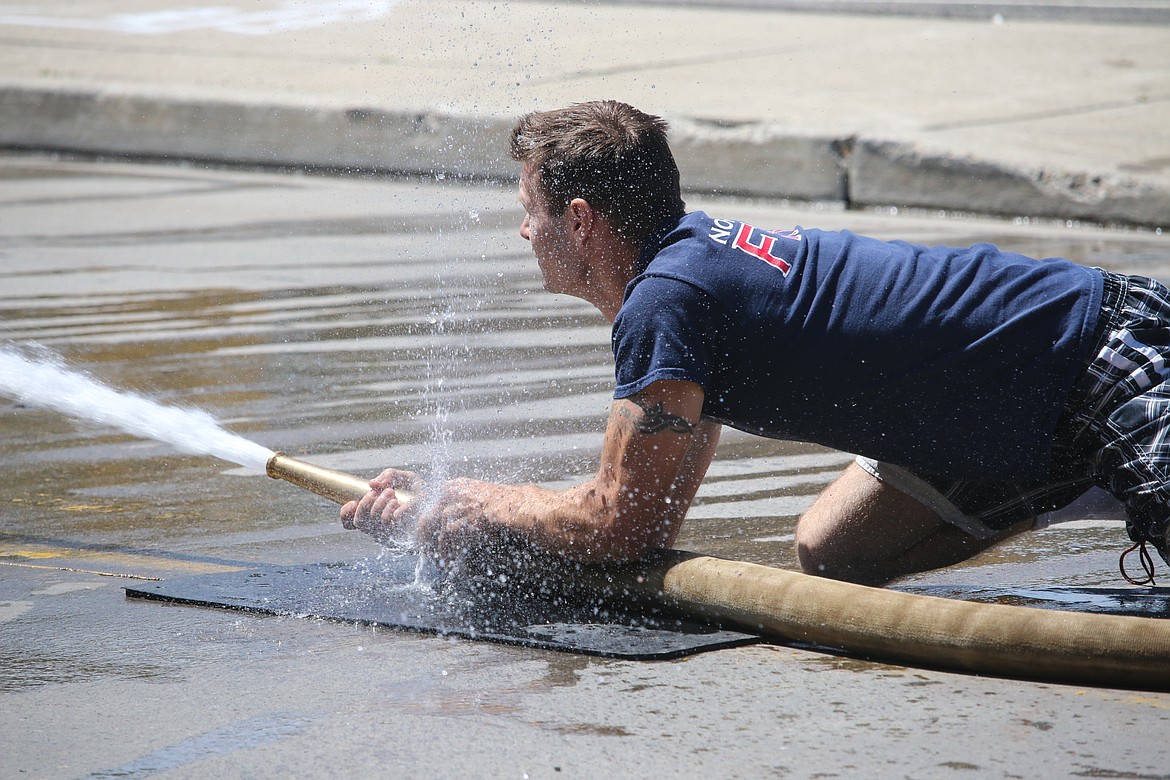 Photo by MANDI BATEMAN
A loose connection did not stop this firefighter.