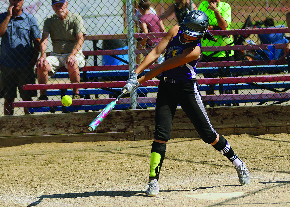 POLSON 12U player McKenna Hanson connects with a softball at this weekend&#146;s USA Fastpitch Tournament in Great Falls. (Jason Blasco/Lake County Leader)