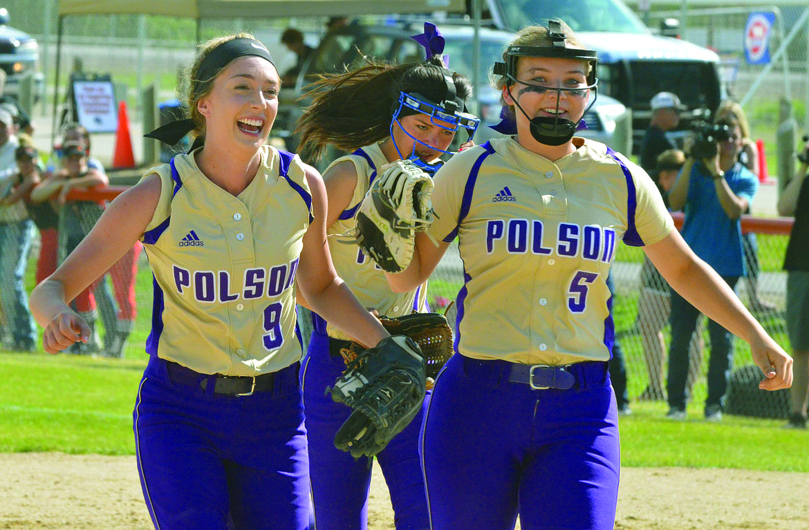 POLSON HIGH School Kaelyn Smith (left) celebrates with Quinn Motichka (right) during the Class A Montana High School Association tournament at Frenchtown High School. Motichka just signed with Dakota State, an NAIA school, to extend her softball career. (Jason Blasco/Lake County Leader)