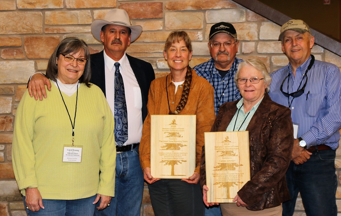 Mineral County leaders received two awards at the Montana Counties Forest Summit held in early May. Superior District Ranger Carole Johnson and the West Zone NEPA Team, led by Pat Partyka, were honored. In the photo, from left, are Carol Young, Roman Zylawy, Pat Partyka, Carole Johnson, Willie Peck and Duane Simons. (Photo courtesy of Mineral County Resource Council)