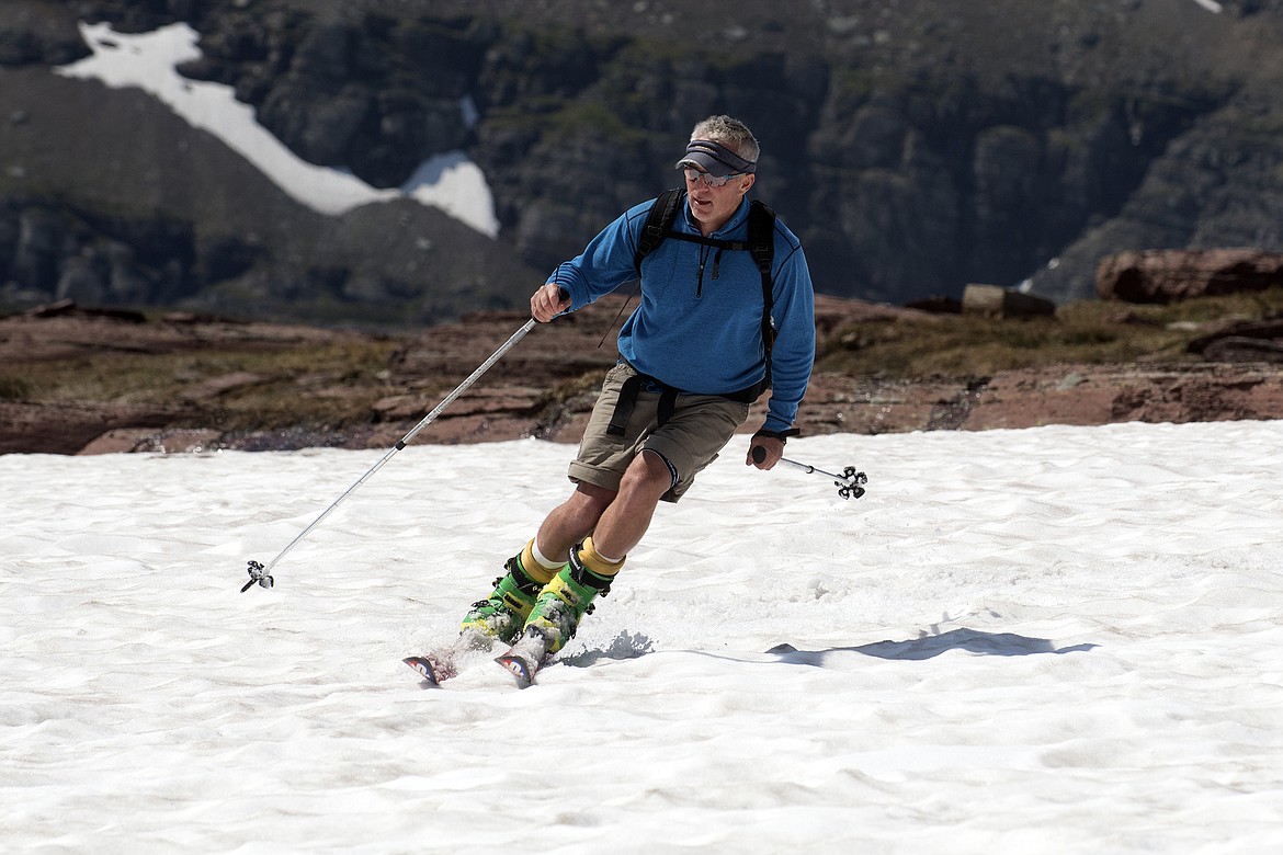 A skier makes his way back to Logan Pass from the Hidden Lake Trail Saturday, July 7. (Jeremy Weber photo)