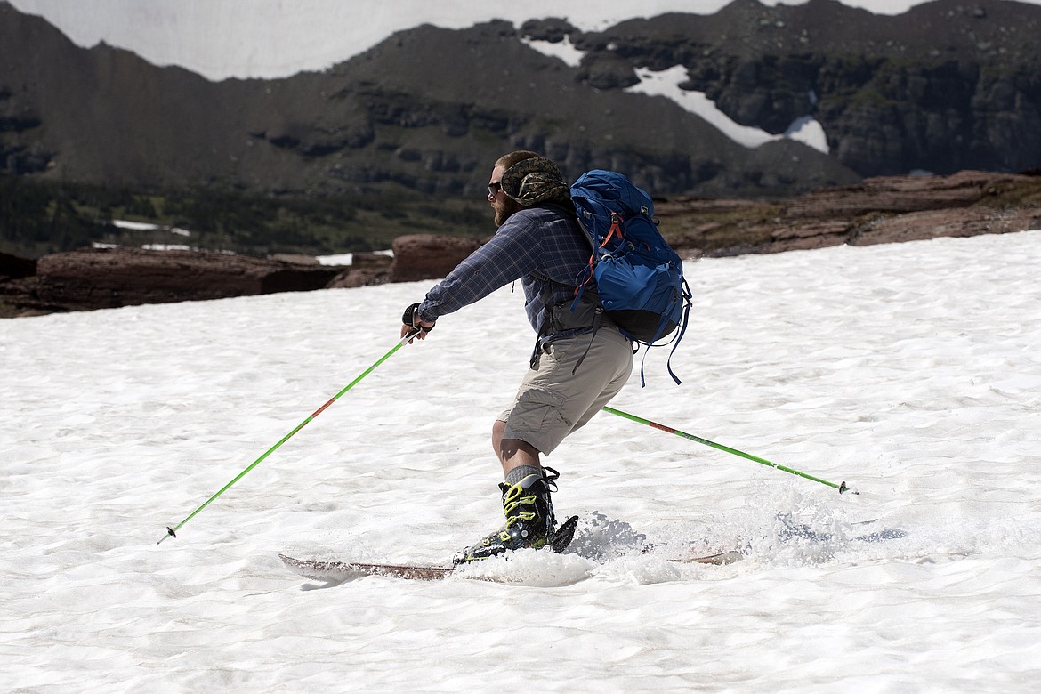 A skier makes his way back to Logan Pass from the Hidden Lake Trail Saturday, July 7. (Jeremy Weber photo)