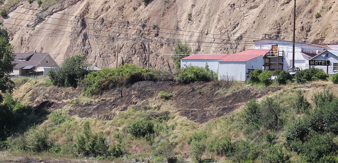 A Fourth of July fire broke out on an embankment off West Mullan Road, and could be seen from the Memorial Bridge in Superior. Two-hundred yards of the steep band were burned, and no injuries were reported. The fire was caused by a firework mortar. (Kathleen Woodford/Mineral Independent)