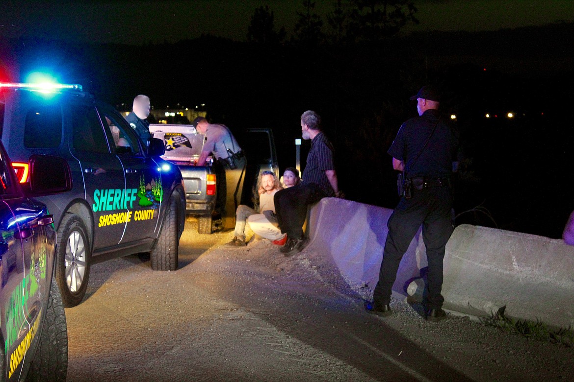 Photo by CHANSE WATSON
Shoshone County Sheriff&#146;s Office deputies search a vehicle they suspect of having illegal drugs while Idaho State Police troopers keep an eye on the occupants. This traffic stop occurred near the I-90 westbound on-ramp in Smelterville.