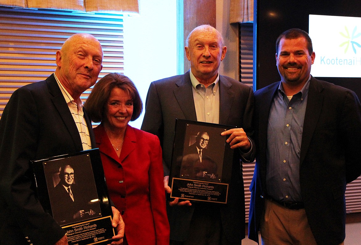 John Richards, left, a timber industry leader who died Wednesday, holds a copy of the Kootenai Health Visionary Leadership Award bestowed posthumously in 2015 upon his father, John Smith Richards, a former Kootenai Hospital District  board member who made significant contributions to the development of Kootenai Health. Pictured also are, from left: Liese Razzeto, Kootenai Health Board Trustee; Tom Richards, John's twin and also a leader in the timber industry; and Mike Chapman, Kootenai Health Foundation board member.