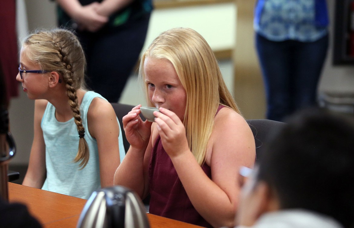 Photos by JUDD WILSON/Press
Kennedy Hartzell of Post Falls drinks tea during a traditional Chinese tea ceremony at the University of Idaho Coeur d&#146;Alene Thursday.
