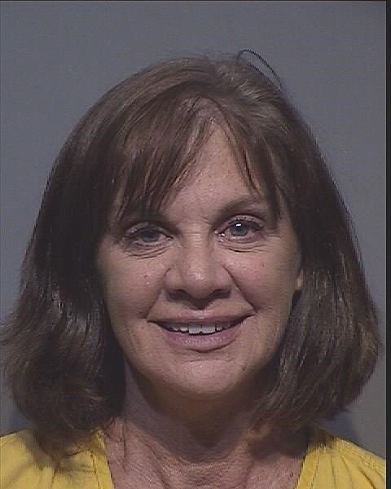 Lori Isenberg's jail booking photo taken late Wednesday, July 25, after she surrendered herself to authorities.