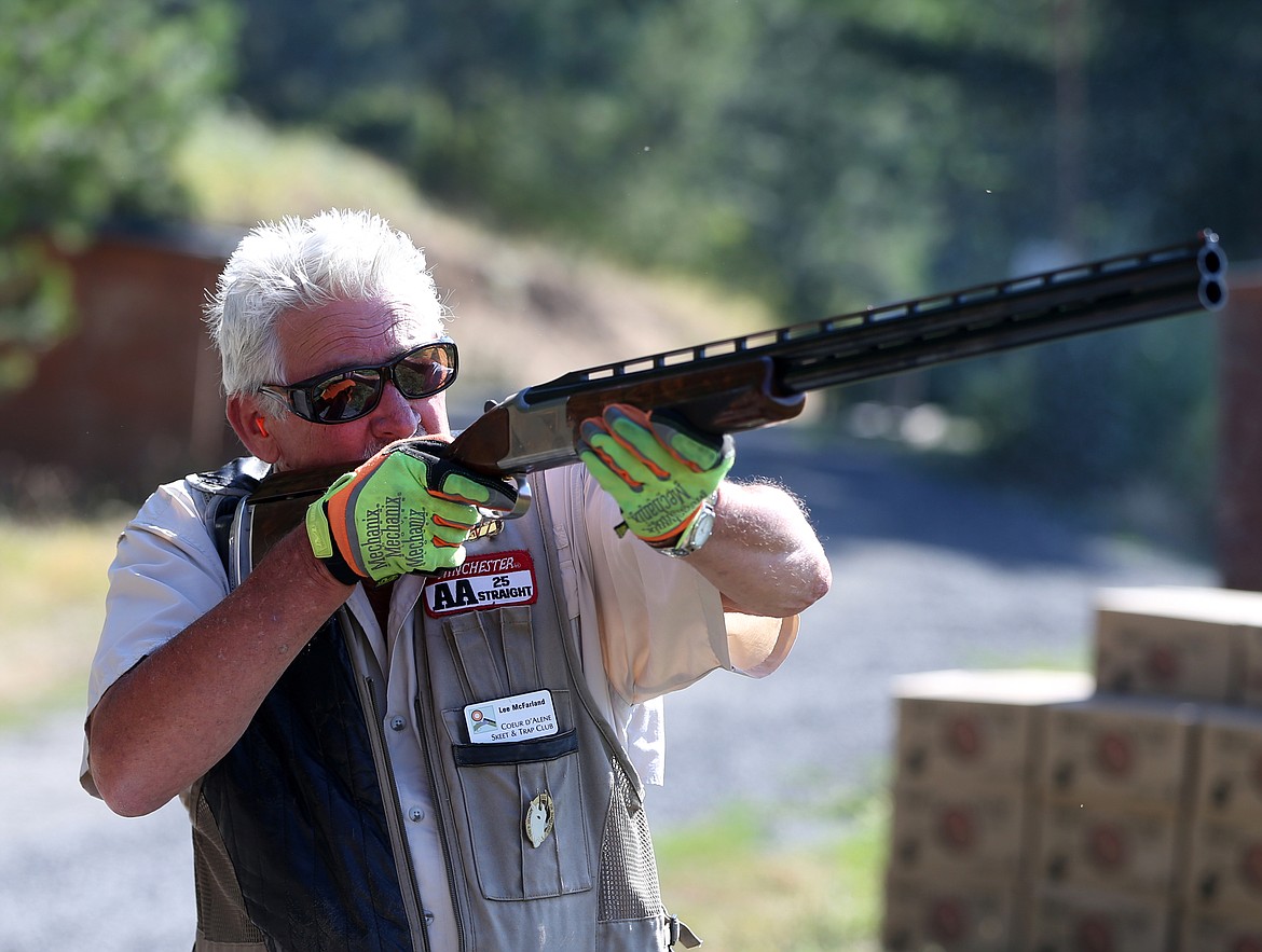 Lee McFarland with the Coeur d'Alene Skeet and Trap Club shoots clays Wednesday morning at Double Barrel Ranch. (LOREN BENOIT/Press)
