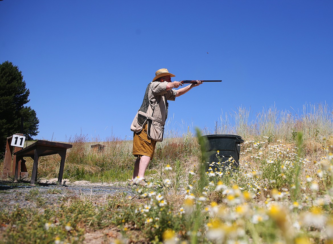 David Noreen with the Coeur d'Alene Skeet and Trap Club shoots clays with a group of friends Wednesday morning at Double Barrel Ranch. (LOREN BENOIT/Press)