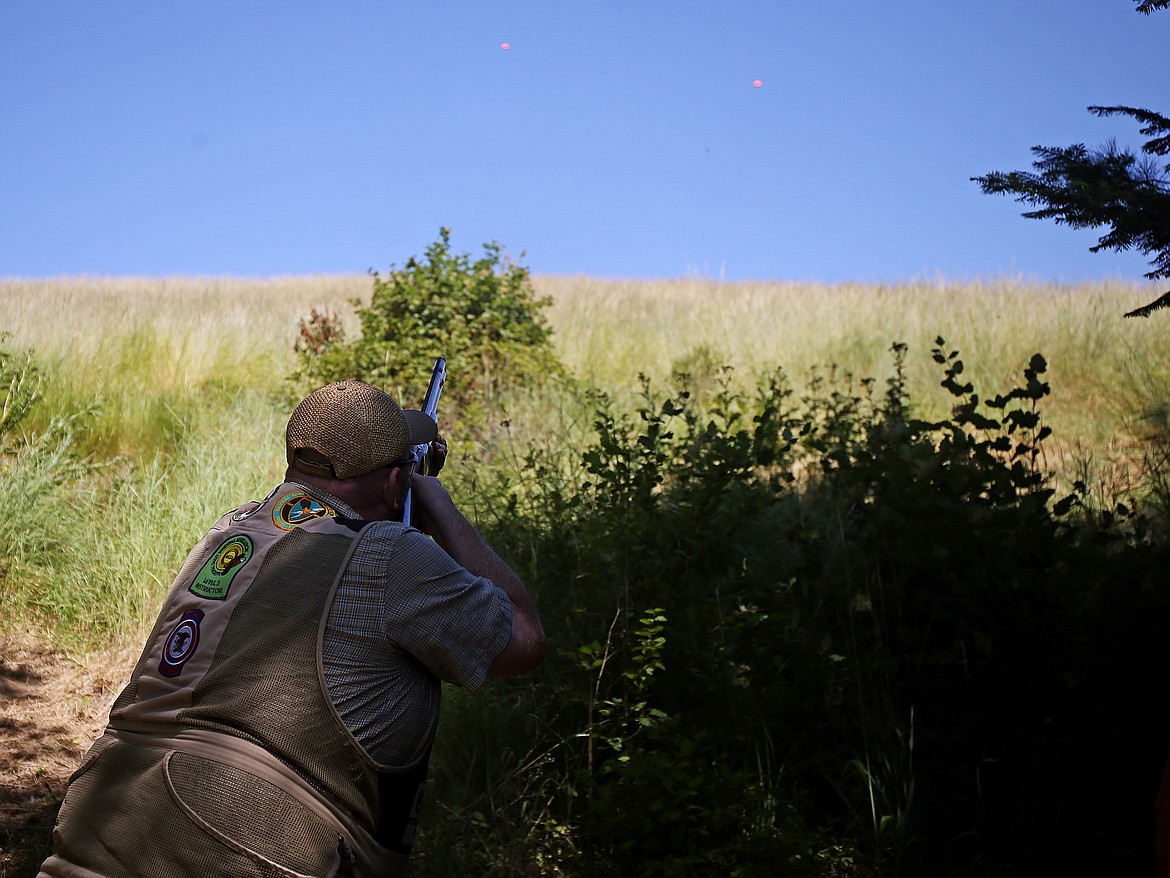 Bill Brooks shoots clays with a group of friends Wednesday afternoon at Double Barrel Ranch. Brooks is a level 3 instructor with the National Skeet Shooting Association. (LOREN BENOIT/Press)