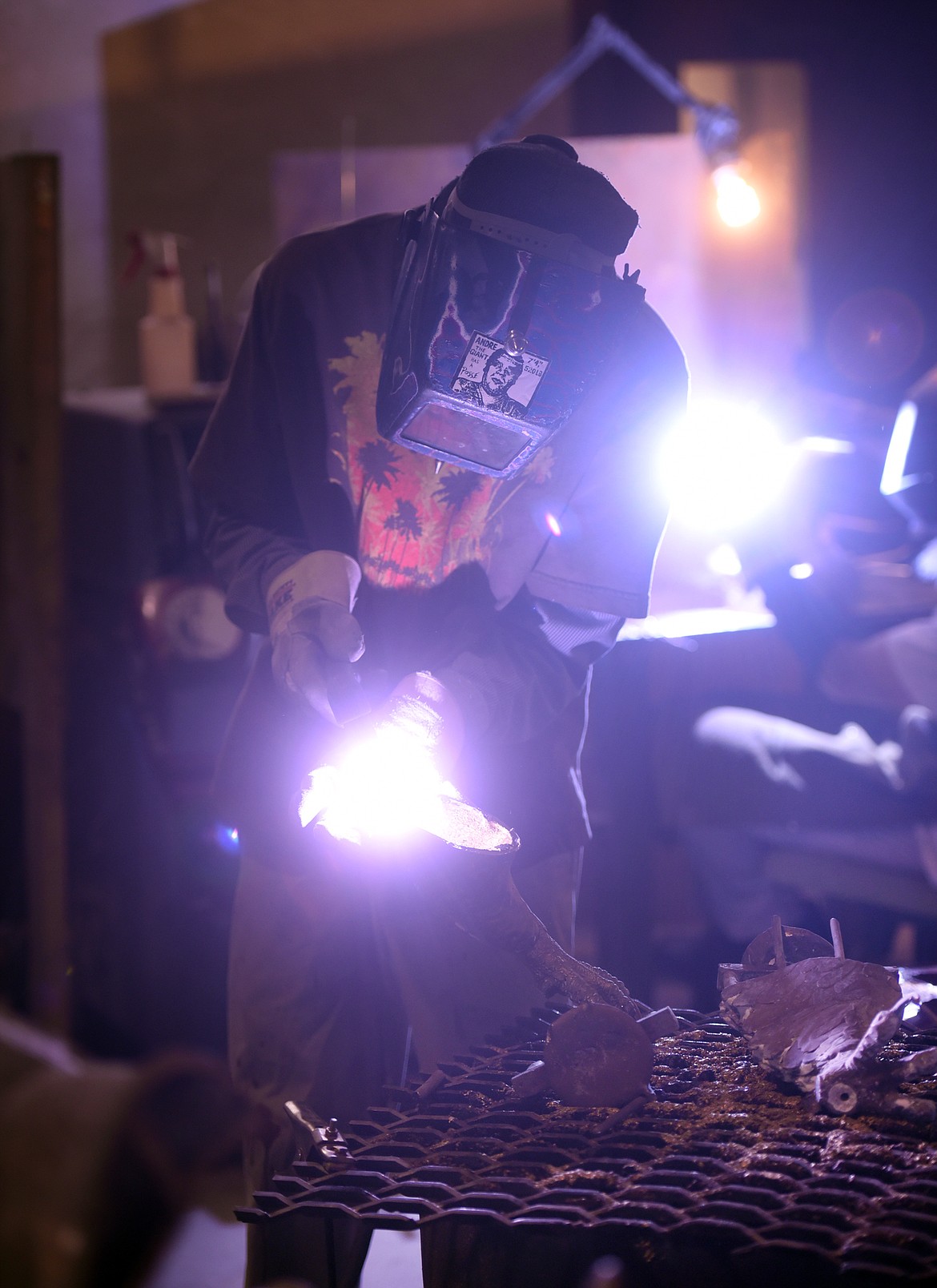 Welders working at Kalispell Art Casting on Monday afternoon, July 17, in Evergreen. The foundry takes care of mould-making, pouring, welding, metal work and patina for numerous artists.(Brenda Ahearn/Daily Inter Lake)