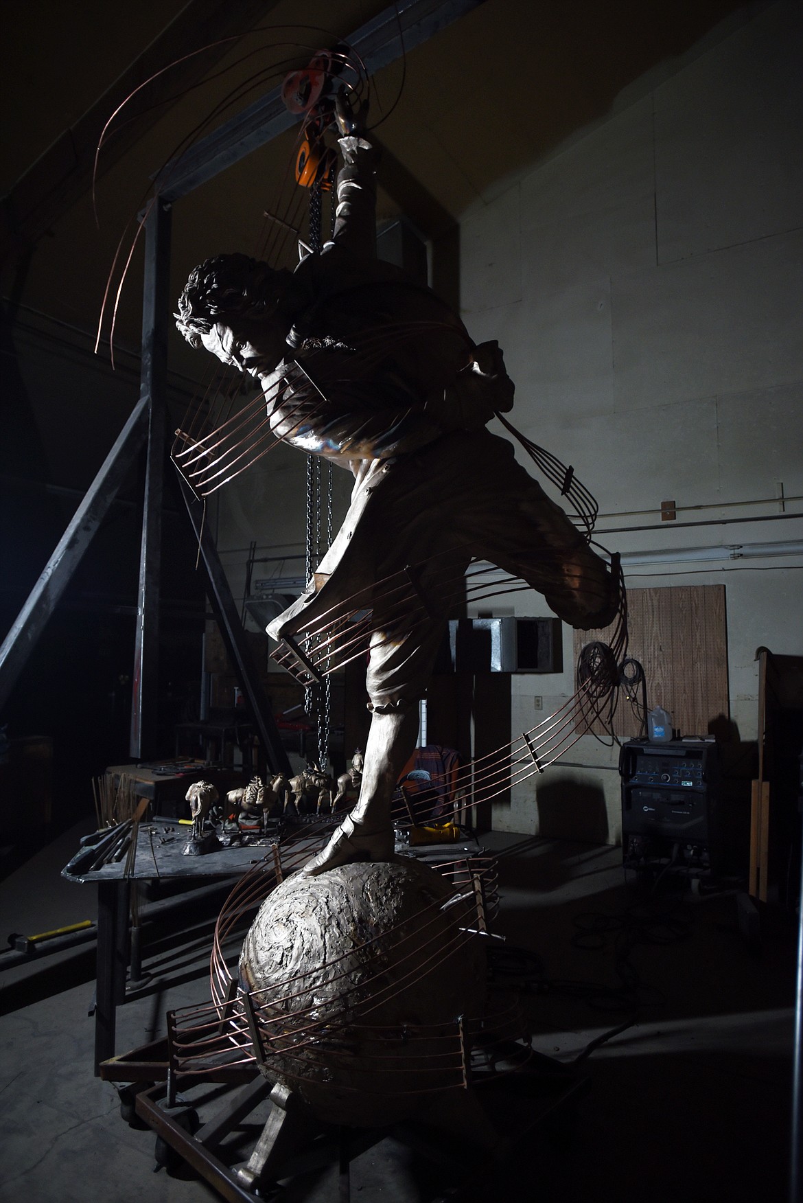 Mike Stephan, left, and Jeremy Fairchild, managers at the Kalispell Art Casting foundry, with the monument sculpture they are currently constructing on Monday afternoon, July 17, in Evergreen. The bronze sculpture of Beethoven by artist Franco Castelluccio is close to 15 feet tall and weighs approximately 800 pounds.(Brenda Ahearn/Daily Inter Lake)Welders working at Kalispell Art Casting on Monday afternoon, July 17, in Evergreen. The foundry takes care of mould-making, pouring, welding, metal work and patina for numerous artists.(Brenda Ahearn/Daily Inter Lake)Jeremy Fairchild adds the patina to a bronze sculpture on Monday afternoon, July 17, at Kalispell Art Casting in Evergreen.(Brenda Ahearn/Daily Inter Lake)The front room at Kalispell Art Casting was designed to be a gallery space but was never utilized to its full potential. Managers Mike Stephan and Jeremy Fairchild hope to turn the space into a genuine gallery where customers can visit the foundry, see how the work is made, and purchase a piece if they choose.(Brenda Ahearn/Daily Inter Lake)Two sculptures by Karl Lansing at Kalispell Art Casting on Monday, July 17. The pieces are in the final steps at the foundry waiting for the wood bases, name plates and their edition numbers.(Brenda Ahearn/Daily Inter Lake)A statue by Sherry Sanders in the final steps at Kalispell Art Casting waiting for a wood base, name plate and the edition number.(Brenda Ahearn/Daily Inter Lake)