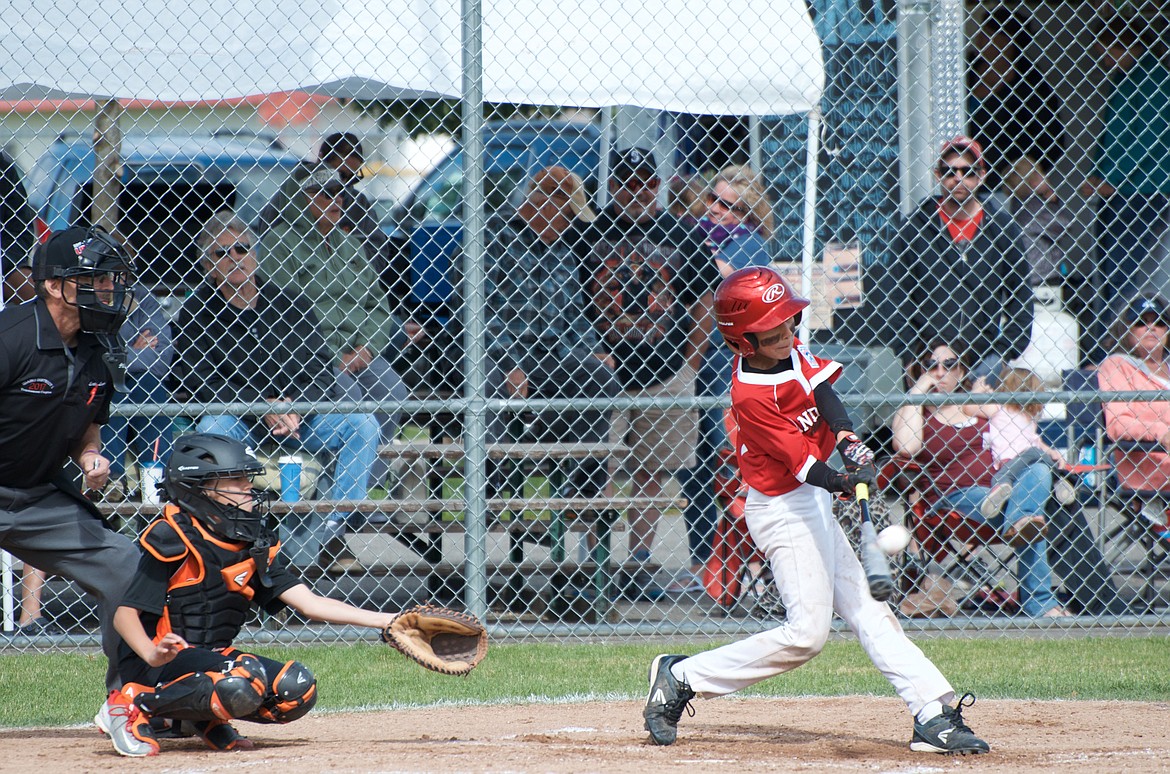 (Photo by CODY MILLER)
Sage Medeiros squares up a fastball in a 13-1 win against Post Falls at the recent district all-star tournament.