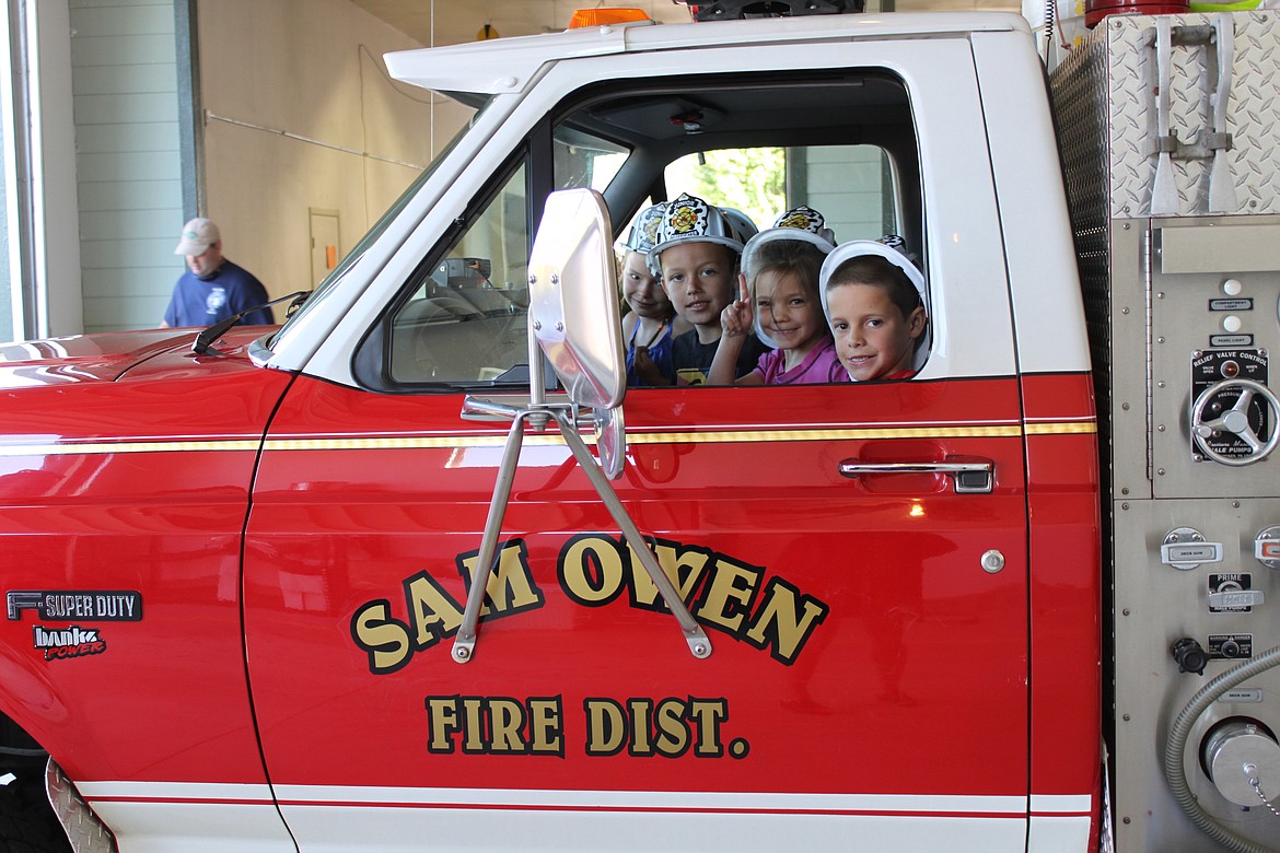 (Courtesy photo)
The Sam Owen Fire District is hosting its 14th annual pancake breakfast from 7:30-11 a.m. this Saturday at Sam Owen Fire Station 1 in Hope, 17 Old Sam Owen Drive. Breakfast is $5 per person and is a fundraiser for the volunteer department. Pictured here, some youngsters, in their new fire chief hats, check out one of the fire engines during the 2017 event.