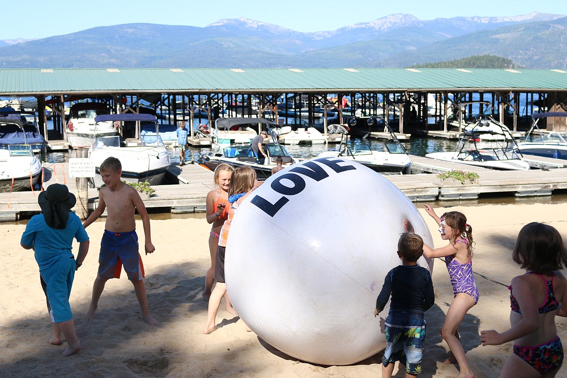 (Photo by MARY MALONE)
Some youngsters play with an enormous beachball during Kidstock 2018 on Sunday at Hill&#146;s Resort in Priest Lake. The event is an annual fundraiser for the Priest Lake Education Foundation.