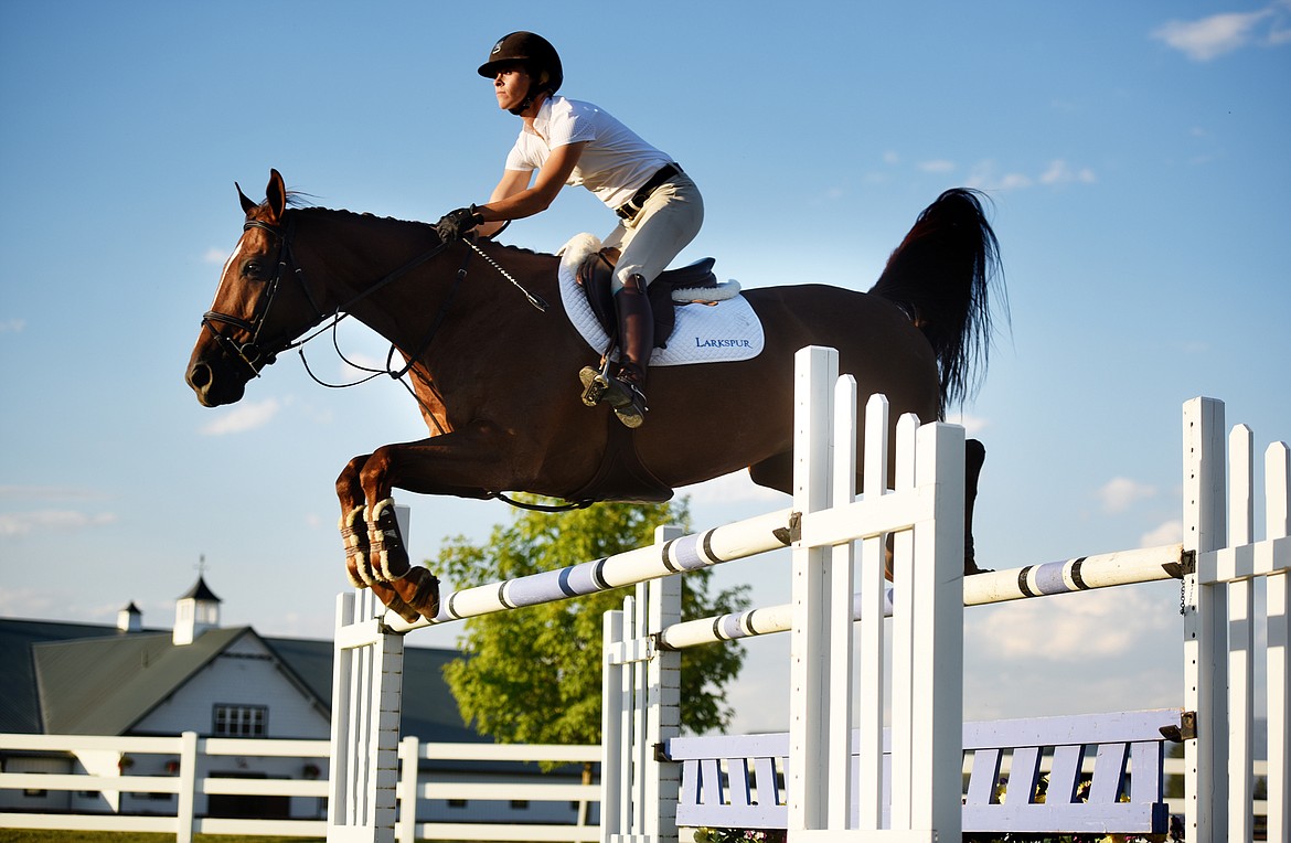 Bryna Closson working with Cair Paravel &#147;Perry&#148; on Tuesday evening, July 24, at Larkspur Farm north of Kalispell.
(Brenda Ahearn/Daily Inter Lake)