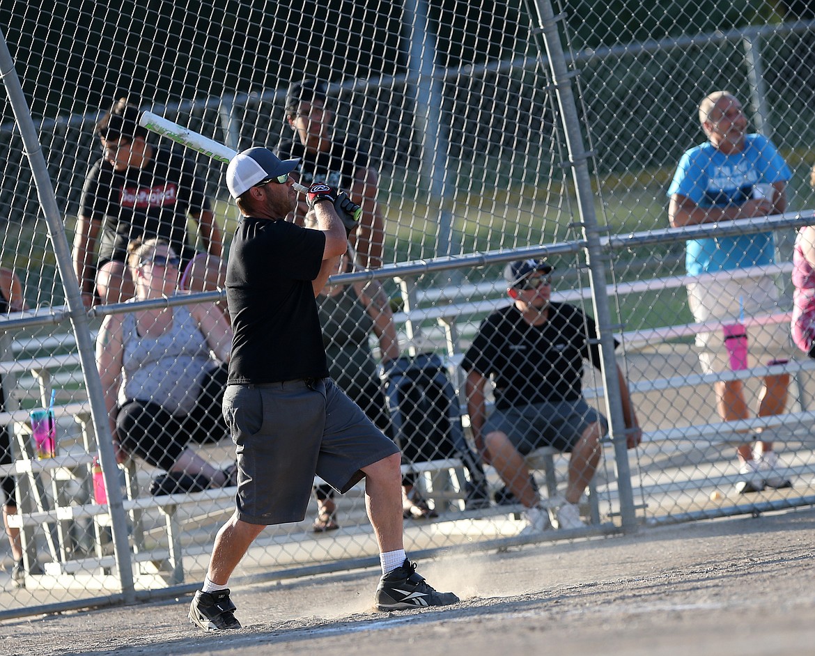 Dann Pearcy of Minton Overhead Door LLC watches his hit during a game against Mountain View Bible Church.