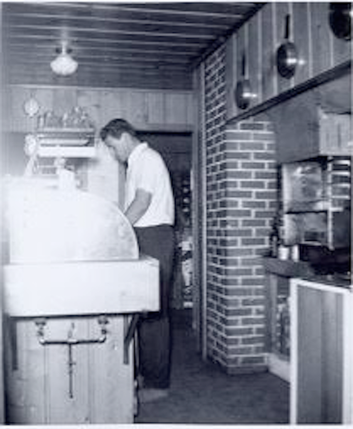 (Photo courtesy HILL'S RESORT)
George Hill cooking in the historical lodge at Hill's Resort.