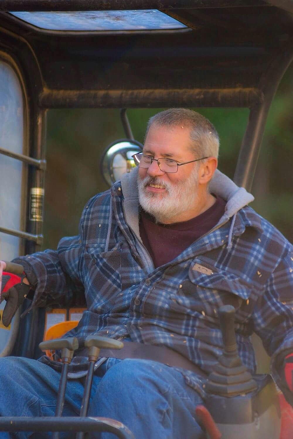 (Courtesy photo) 
Even after a multiple sclerosis diagnosis left him paralyzed from the chest down, Doug Cook enjoys spending his days doing chores with his excavator. Cook was named the 2018 Bull of the Woods by the Priest River Chamber of Commerce after a 50-year career in the local timber industry.