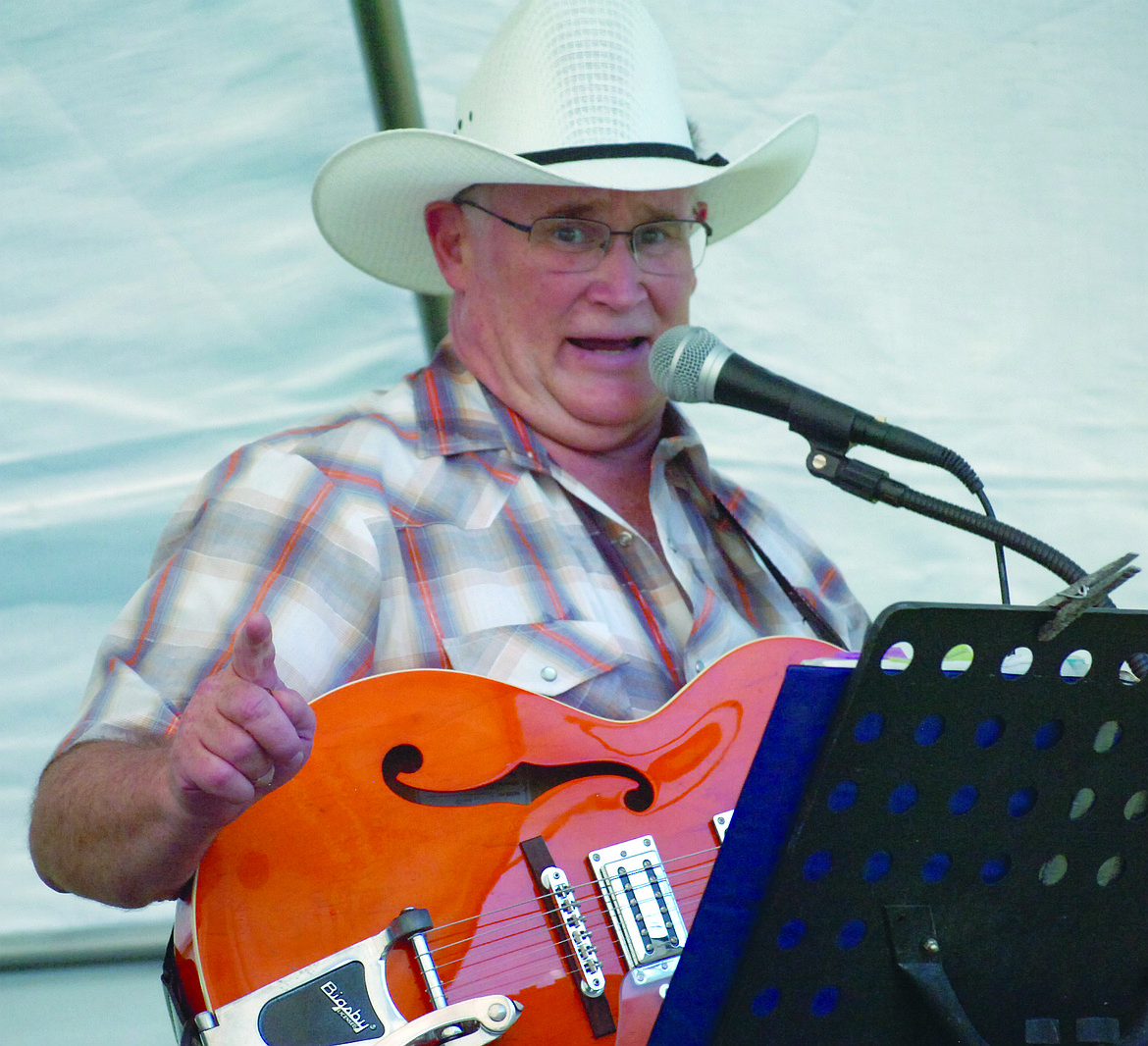 Providing entertainment the evening of Wednesday, July 25 was the Little Big Band, a local trio. Pictured is James Pettit on guitar and lead vocal. Other band members are Shirley Pettit, keyboard and vocals, and James Tobel, lead guitar.