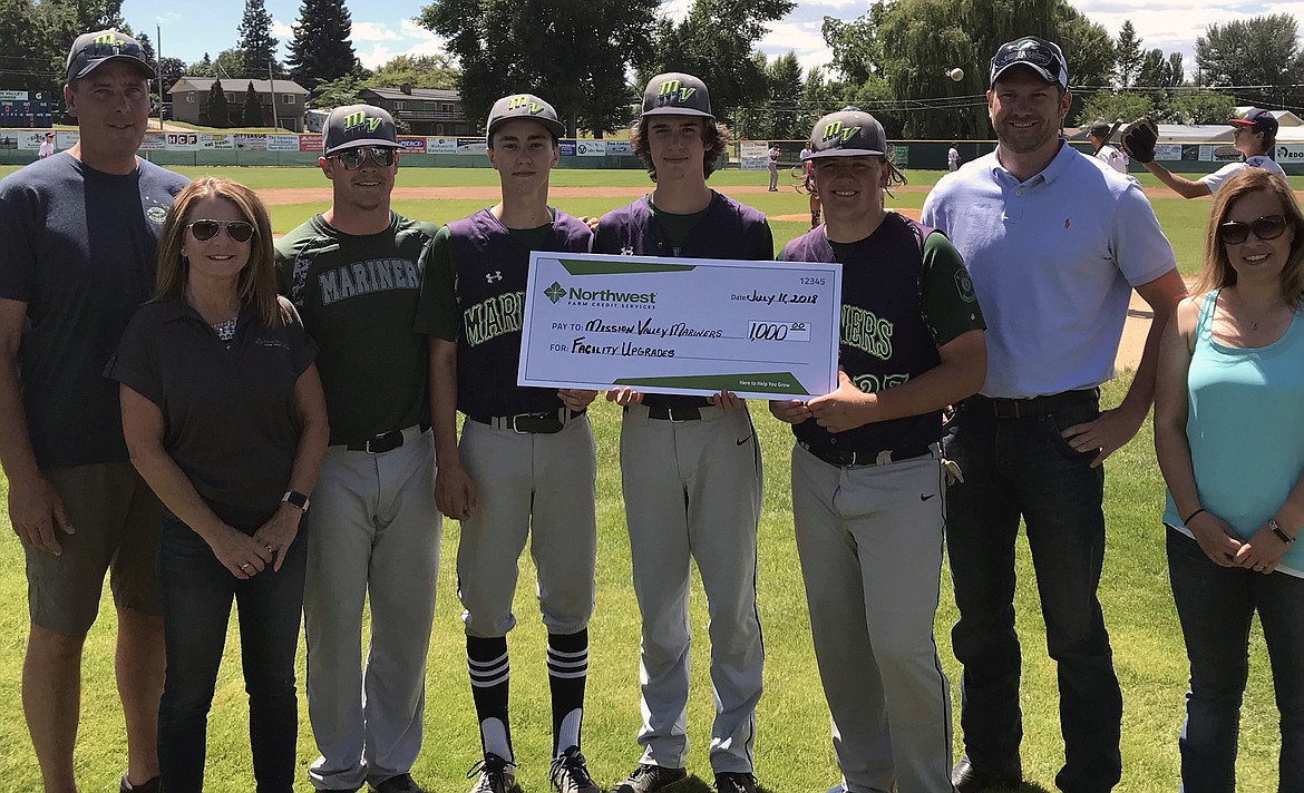 THE MISSION Valley Mariners baseball team was presented a check on July 11 from the Rural Community Grant. Pictured (from left): Tim Lake, LAC member; Joey Hennes, NWFCS employee; Tim Rausch, Mariners head coach; Bryant Hales, Dylan Wisenewski and Corbin Davis, Mariners; Scott Kesler, NWFCS employee; and Amanda Hall, NWFCS employee. The Mission Valley Mariners are preparing for District play against the Kalispell Lakers at 10 a.m. Thursday in Hamilton. (Courtesy photo)