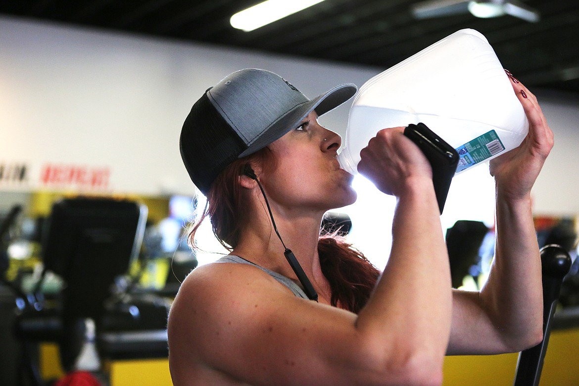 Kjersti Day hydrates between sets at Fuel Fitness in Kalispell where she works as a trainer and also prepares for bodybuilding competitions. Three weeks out from nationals, Day drinks at least a gallon per day.