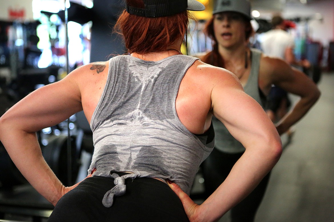 KJERSTI DAY works up a sweat at Fuel Fitness while lifting weights.