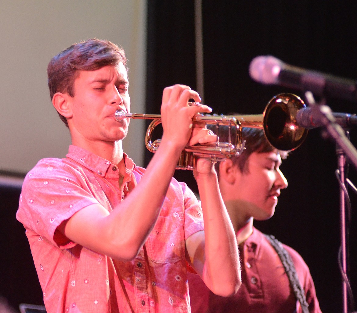 Gimmic member Eric Holdhusen plays the trumpet during the band&#146;s performance Wednesday night at the O&#146;Shaughnessy Center for the Montana Music Event, a benefit concert to support the North Valley Music School.