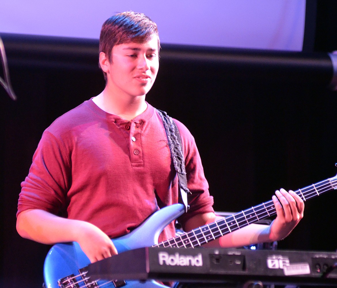 Local band Gimmic member Matthew Perez plays the bass during the band&#146;s performance Wednesday night at the O&#146;Shaughnessy Center for the Montana Music Event, a benefit concert to support the North Valley Music School.