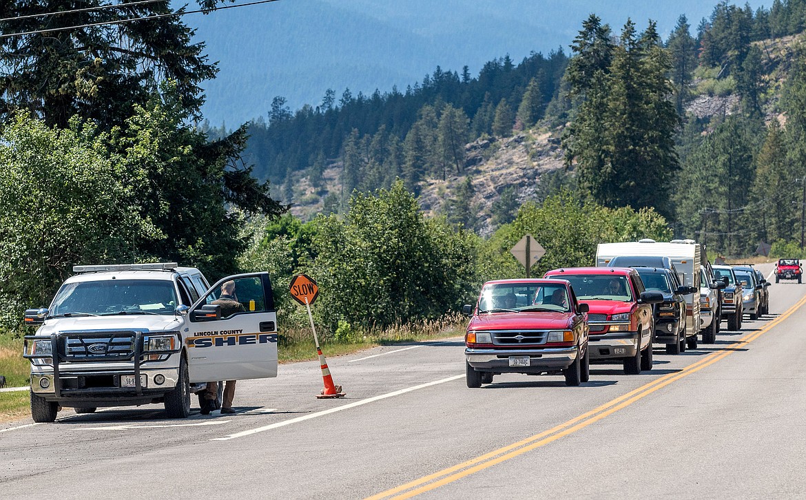 Lincoln County Sheriff&#146;s Deputy Brent Faulkner mans a traffic stop on Highway 37 Saturday. Traffic was occasionally stopped during firefighting activities related to the Highway 37 fire. (John Blodgett/The Western News)