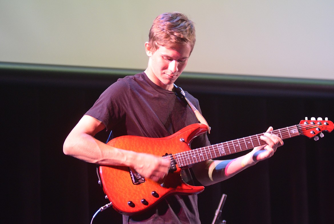 Gimmic member Port Nugent plays during the band&#146;s performance Wednesday night at the O&#146;Shaughnessy Center for the Montana Music Event, a benefit concert to support the North Valley Music School.