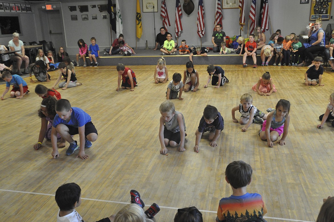 GROUPS OF kids used plastic &#147;thumb-jumper&#148; bugs for the 33rd Annual Bug Race held at Elks Lodge 1695 in Polson last week. (Ashley Fox/Lake County Leader)