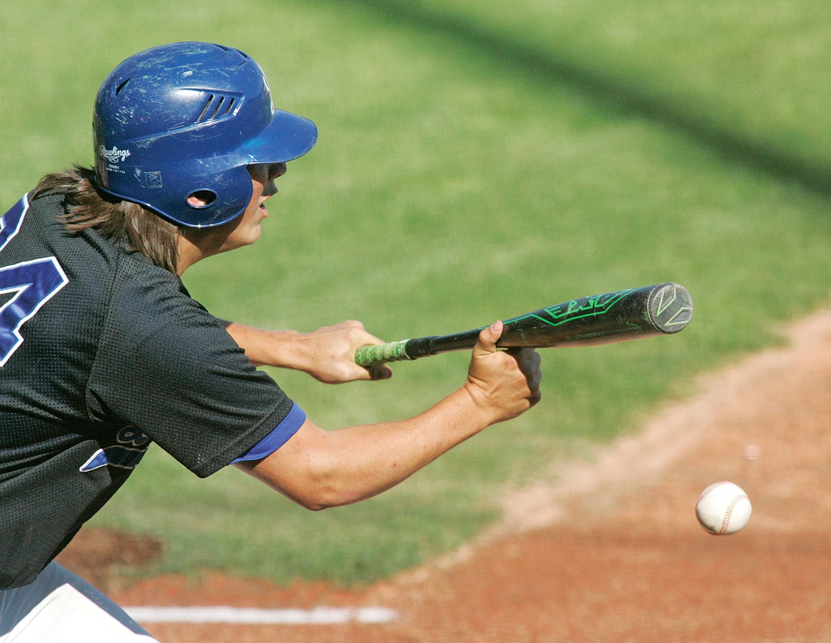 Quade Anderson bunts his way to first, sending Tim Carvey to third, bottom of third inning Friday in the first of a doubleheader vs. the Missoula Mavericks. (Paul Sievers/The Western News)