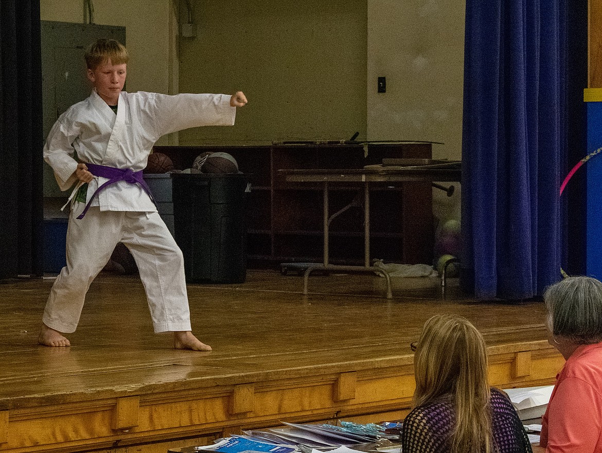 Eight year-old Mannix Montgomery demonstrates his taekwondo knowledge during the performing arts portion of the 2018 Lincoln County Junior Fair. (Ben Kibbey/The Western News)