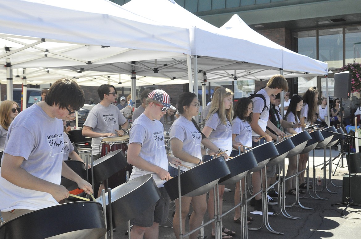 STUDENTS WITH Bram Brata, a group from eastern Washington, entertain the masses during the Cherry Festival in downtown Polson.