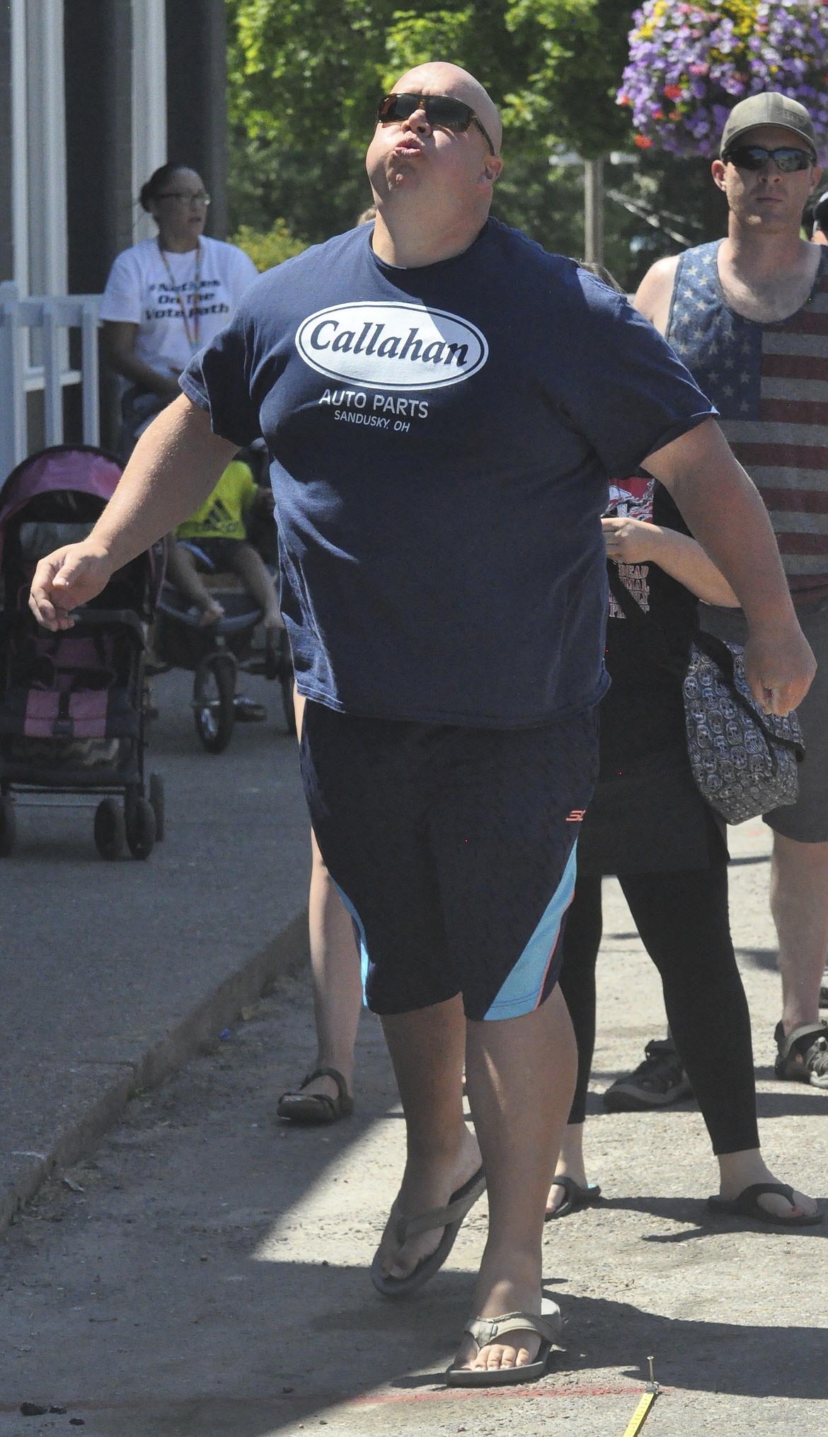 PIT-SPITTING CONTESTANT Tyler Maxwell of Helena won the adult competition, hosted by The Cove, with a distance of 27 feet. (Ashley Fox/Lake County Leader)